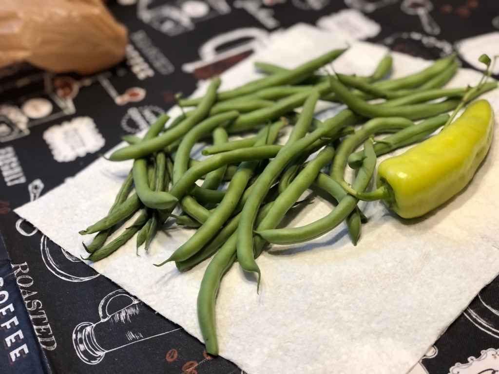 freshly harvested green beans and banana peppers